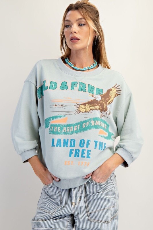 Easel Women’s Eagle Graphic Print Mineral Washed Terry Knit Top in Blue