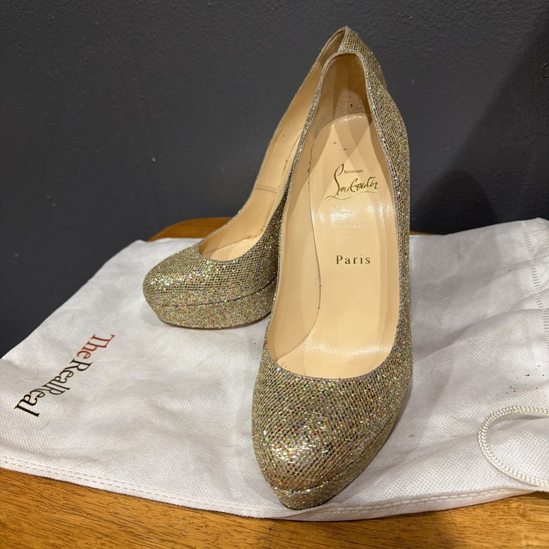 Christian Louboutins Gold Glitter Bibi 140 Platform Pumps