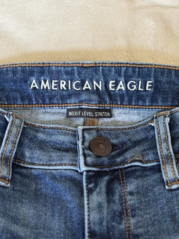 American Eagle Women’s Blue Medium Wash Mid Rise Distressed Stretch Skinny Jeans gallery